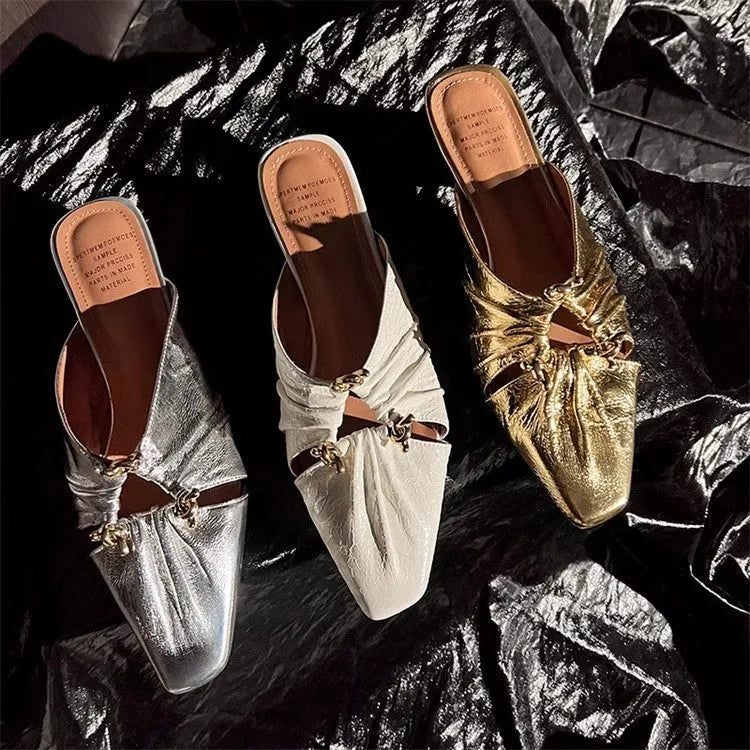 Women's genuine leather slipper with a square toe in a gold colour, showing the low heel and slip-on design.