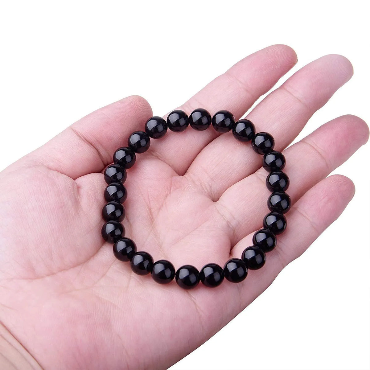 Geometric black agate bracelet with 8mm beads on elastic cord for women.