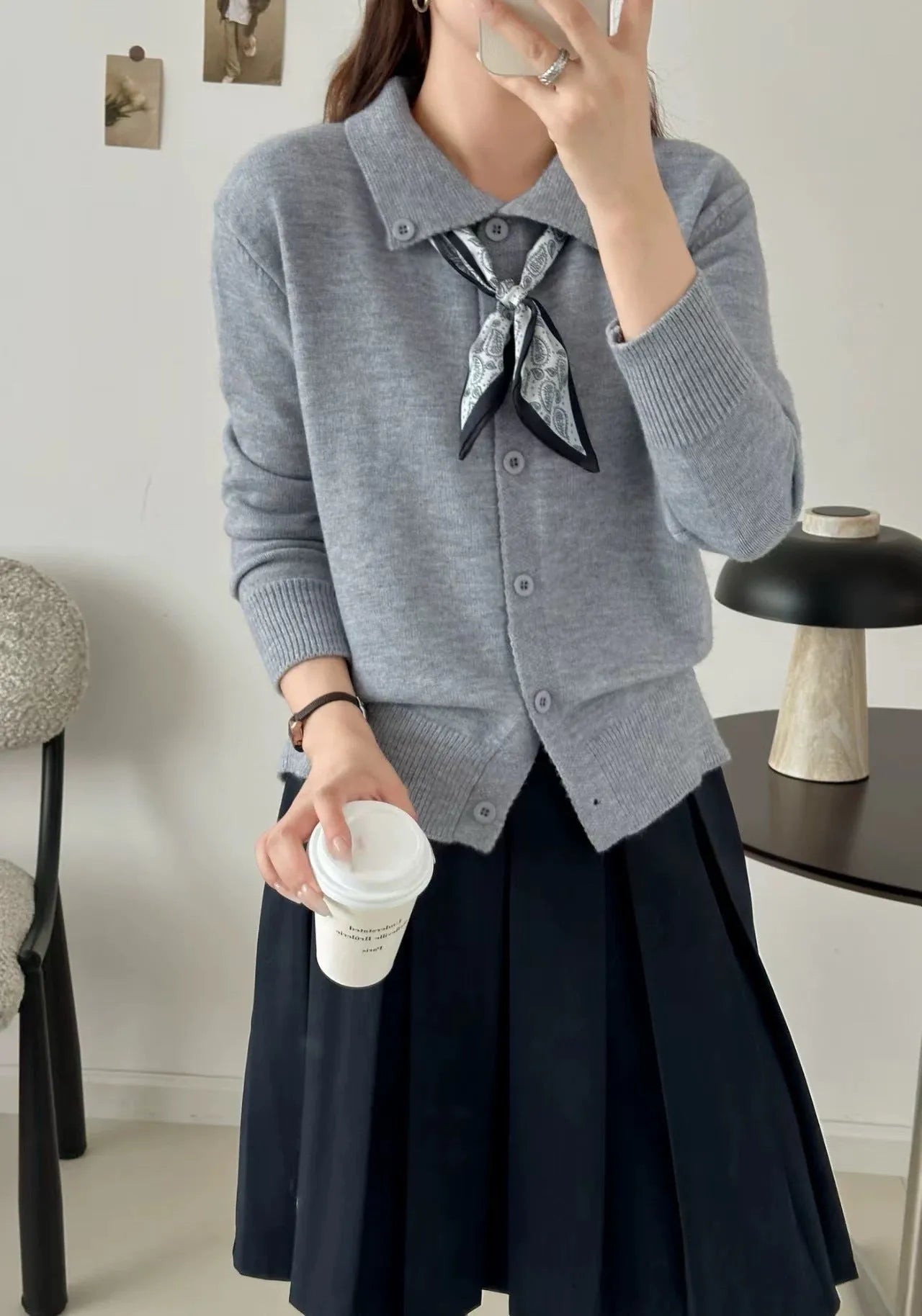 Ladies' grey lapel scarf cardigan sweater on a hanger