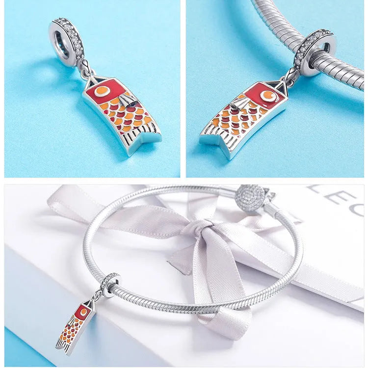 S925 sterling silver carp streamer pendant with oxidised finish, zircon stone, and oil drop decoration.