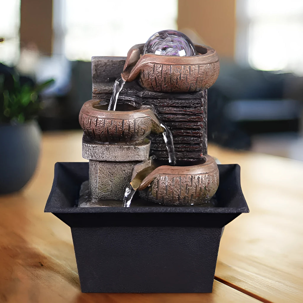 European desktop fountain with running water crystal ball intricate carved rustic design on wooden table