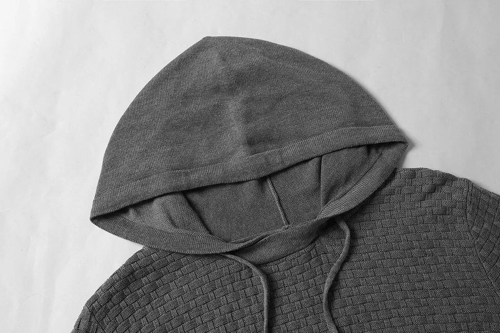 Men's black cotton-polyester hooded sweatshirt on a hanger