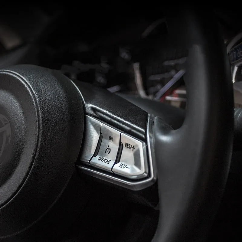 Eight aluminium alloy steering wheel decorative stickers with hollow button design in brushed metallic finishes