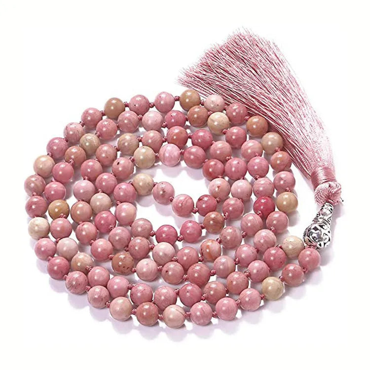 Long multicoloured agate tassel necklace with geometric beads and a flowing pendant.