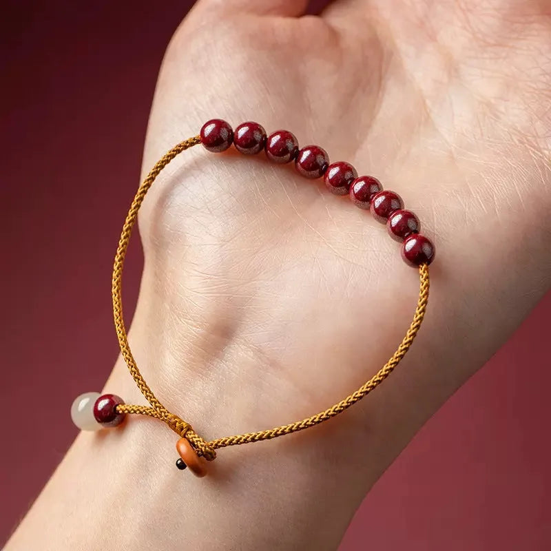 Cinnabar and Hetian jade geometric bracelet with hand-woven construction