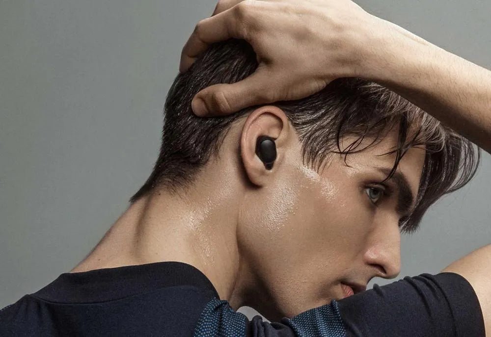 Redmi AirDots Black true wireless Bluetooth earbuds and charging case.