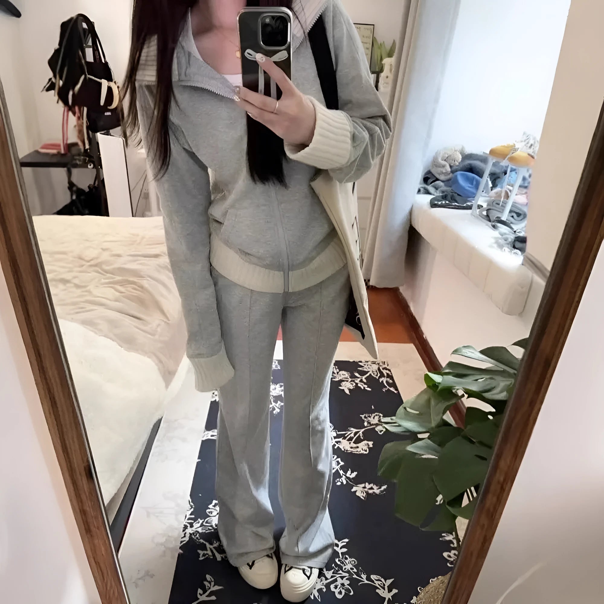 Women's light gray polyester two-piece set consisting of a pocket coat and wide leg trousers, shown flat lay view.
