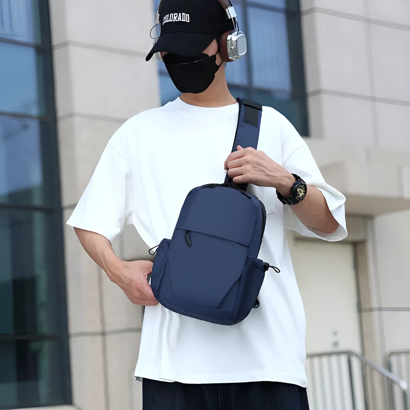 Mens grey waterproof chest bag showing front compartment and shoulder strap