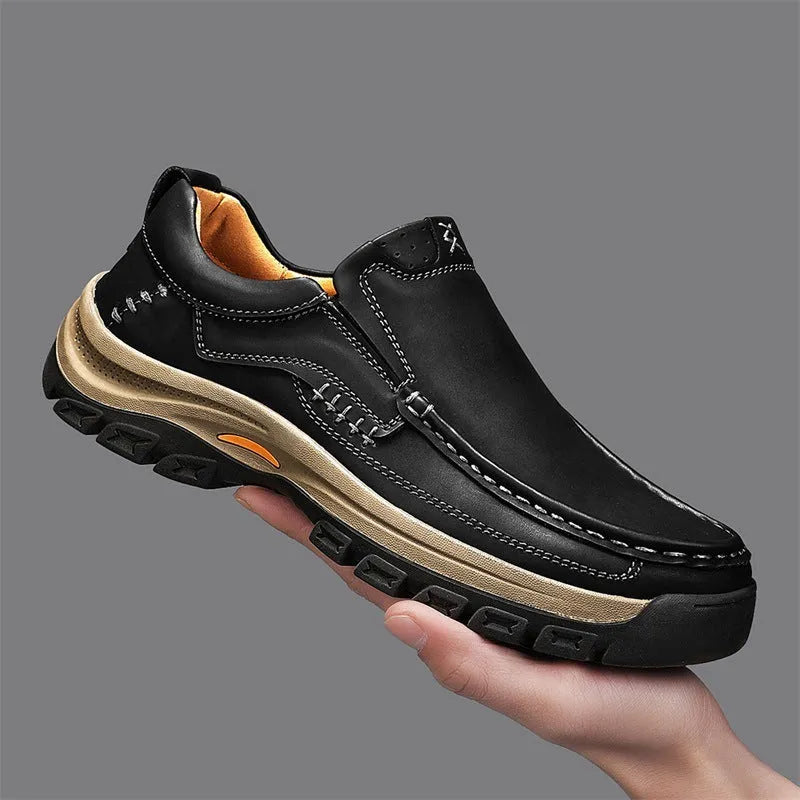 Men's black thick-soled outdoor mountaineering shoes with round toe and rubber sole.