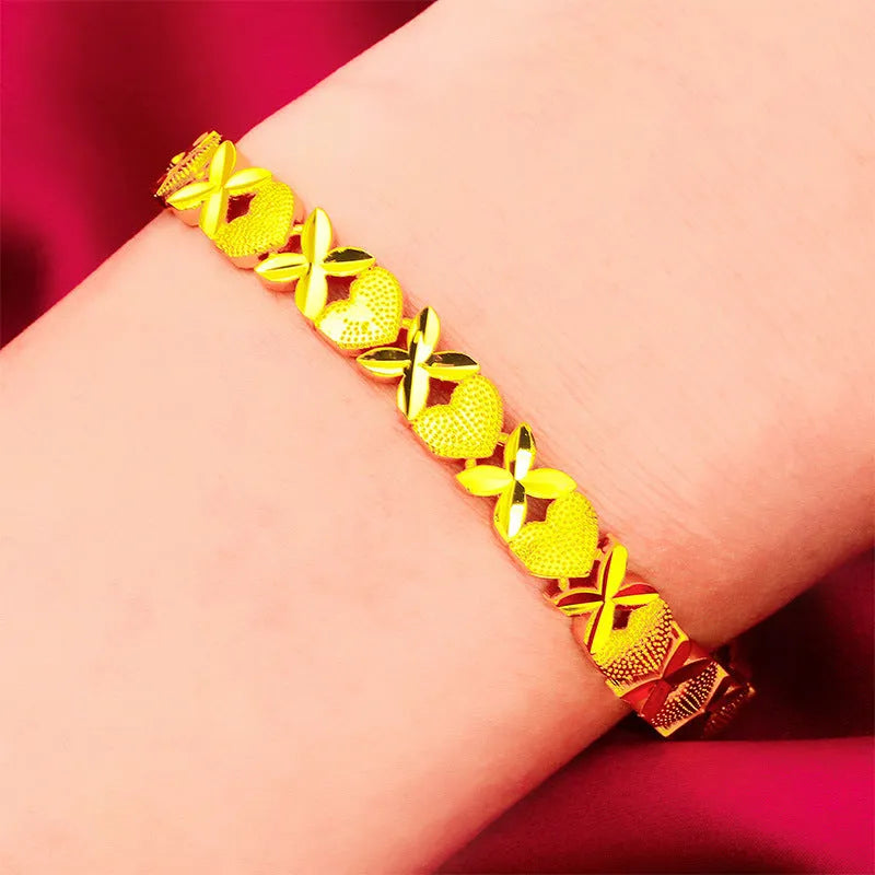 Sand gold four-leaf clover heart bracelet in brass with electroplated textured finish