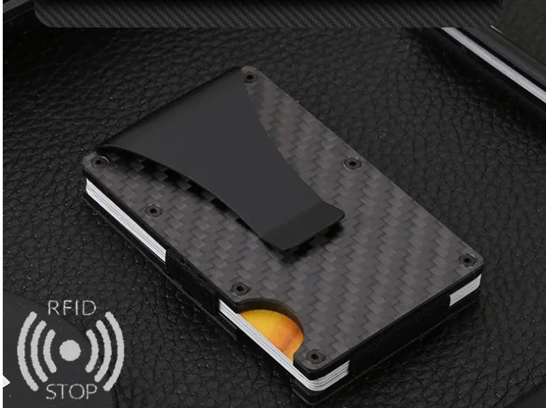 Black carbon fiber and aluminum RFID anti-magnetic card holder wallet on flat surface