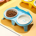 Ceramic cat bowl set with elevated tilted feeding stand in blue, pink, white, and yellow colour options
