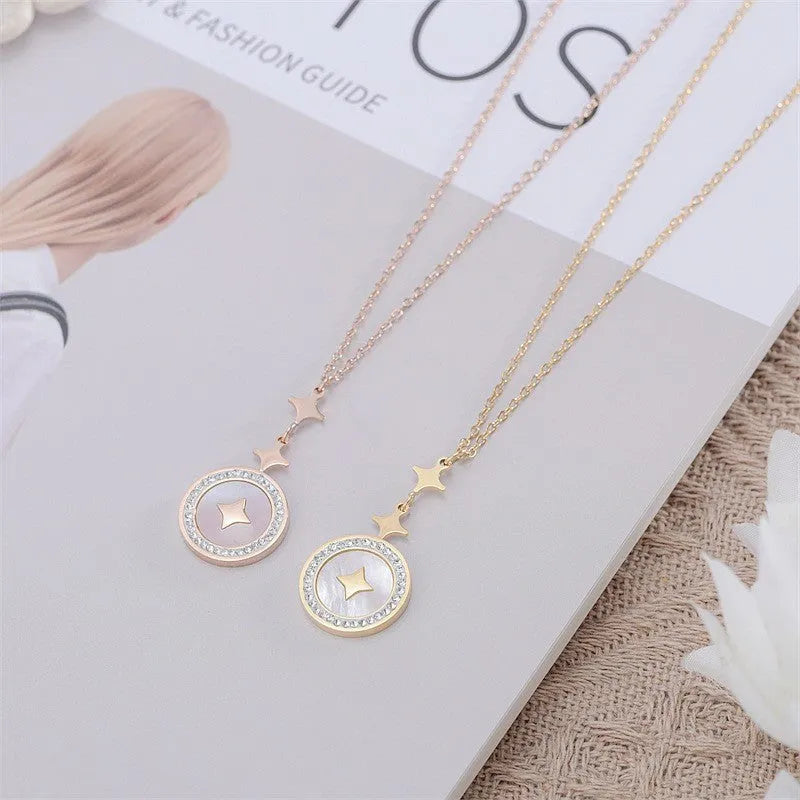 Gold titanium steel women's necklace with hexagonal star pendant on O-ring chain.