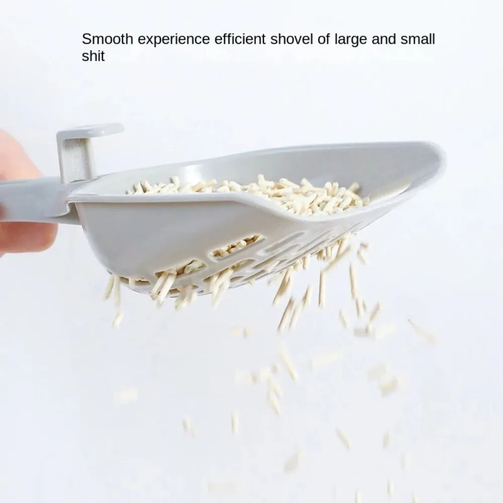 Grey plastic cat litter scoop with metal handle and matching storage base tray