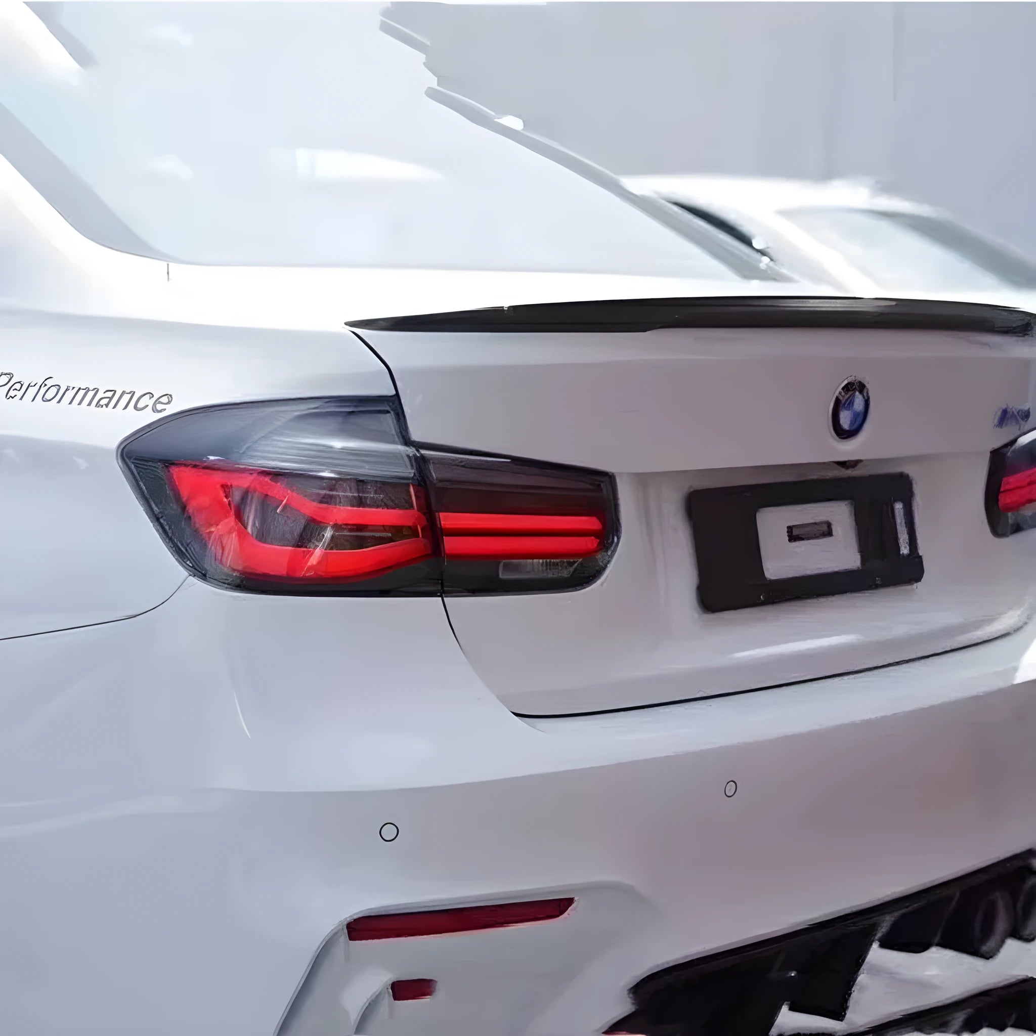 BMW 3 Series tail light assembly with streamer design and LED running lights for 2012-2015 models