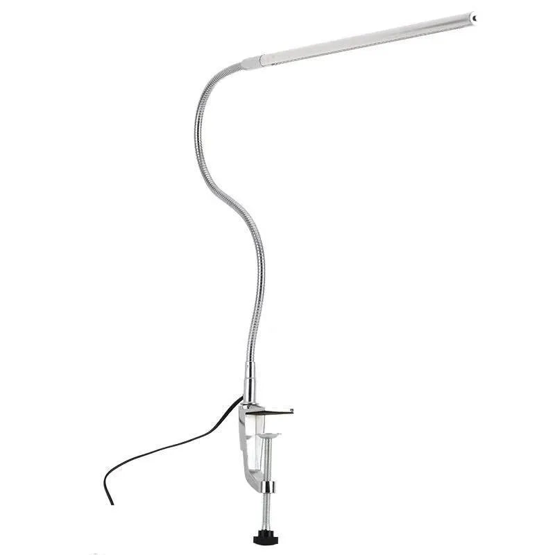 Silver aluminium LED nail lamp with long adjustable arm and clip mounting for workstation illumination