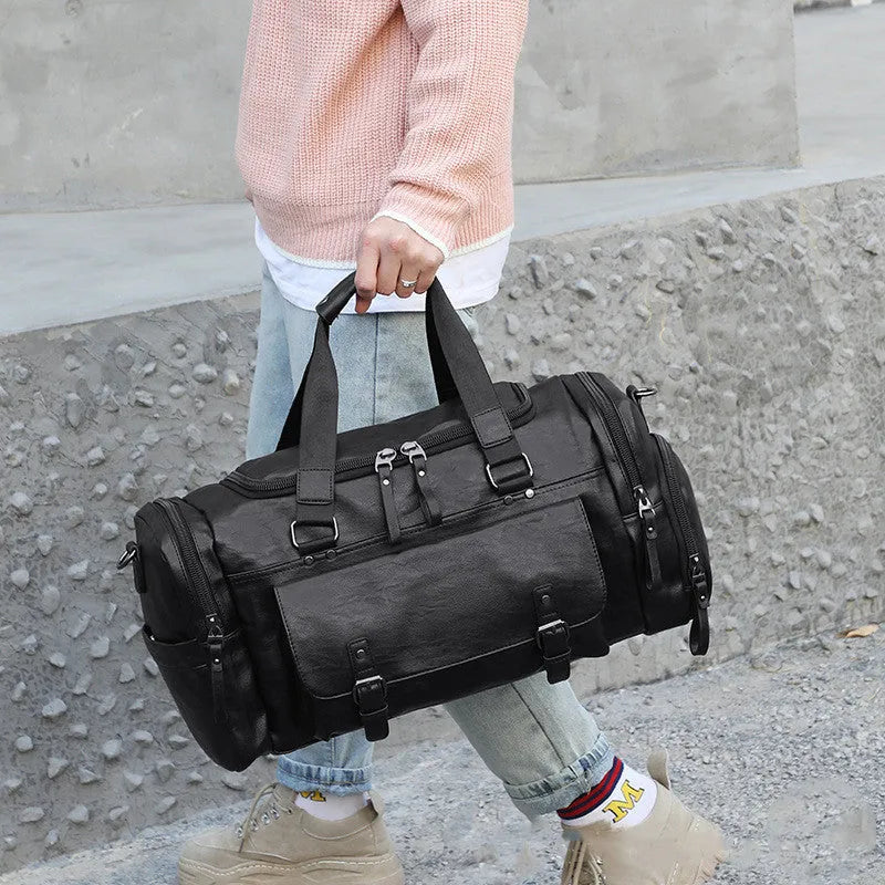 Large black duffel bag with a separate compartment for shoes, showing its 52cm size.