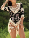 Women's apricot sun protection shirt with V-neck and loose sleeves for beachwear.