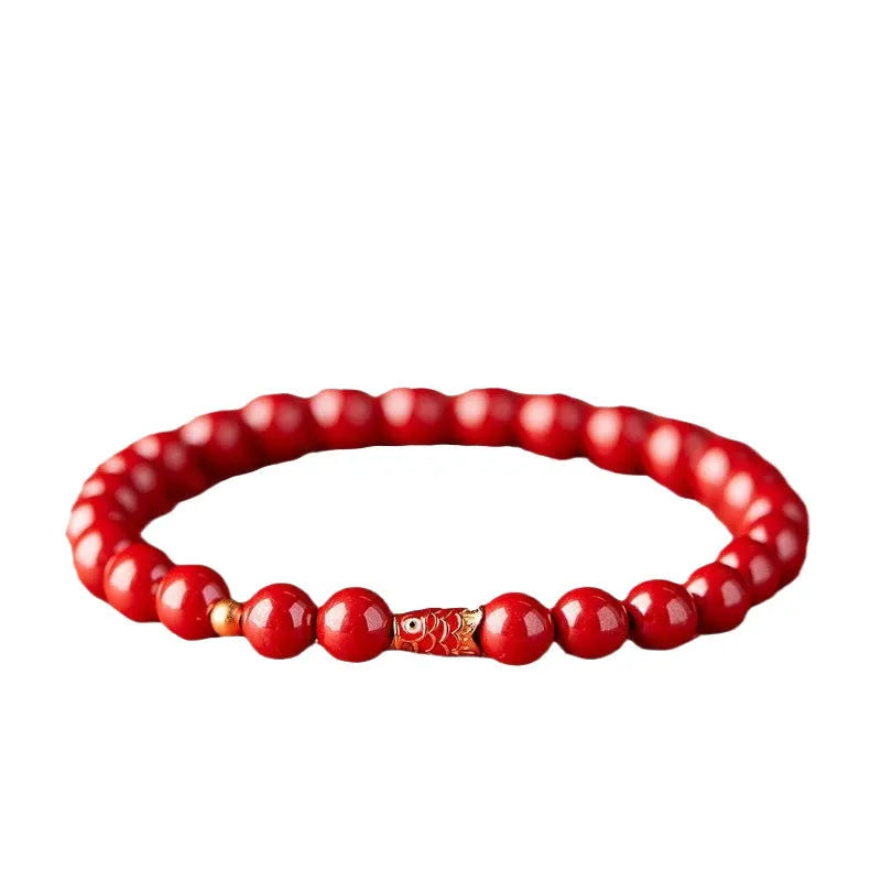 Natural cinnabar koi bracelet with golden ball design in Chinese national style