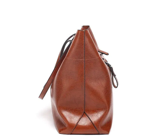 Women's wax cowhide leather crossbody handbag in five colour options showing two compartments and phone pocket.