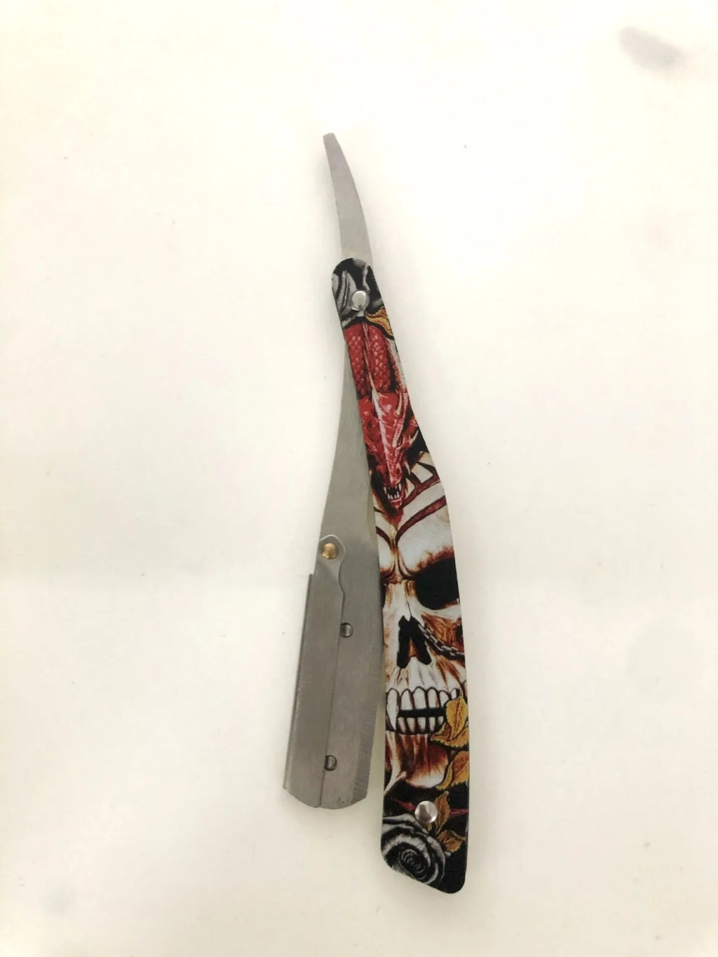 Manual shaver with clown skull design, 74 blade, red pattern black colour option