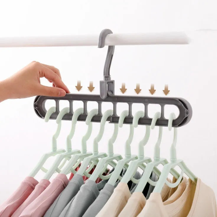 Plastic coat hanger with rotating hook in pink colour, showing length and height dimensions