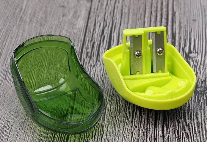 Double hole pencil sharpener with closed design for normal and thick pencils in random colour