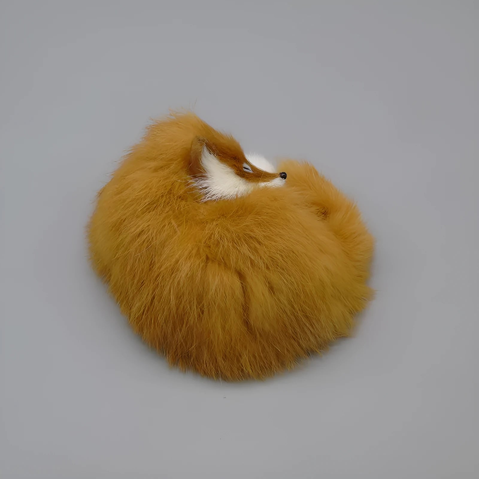 Artificial fox fur car decoration in white, yellow and red colours measuring 15cm
