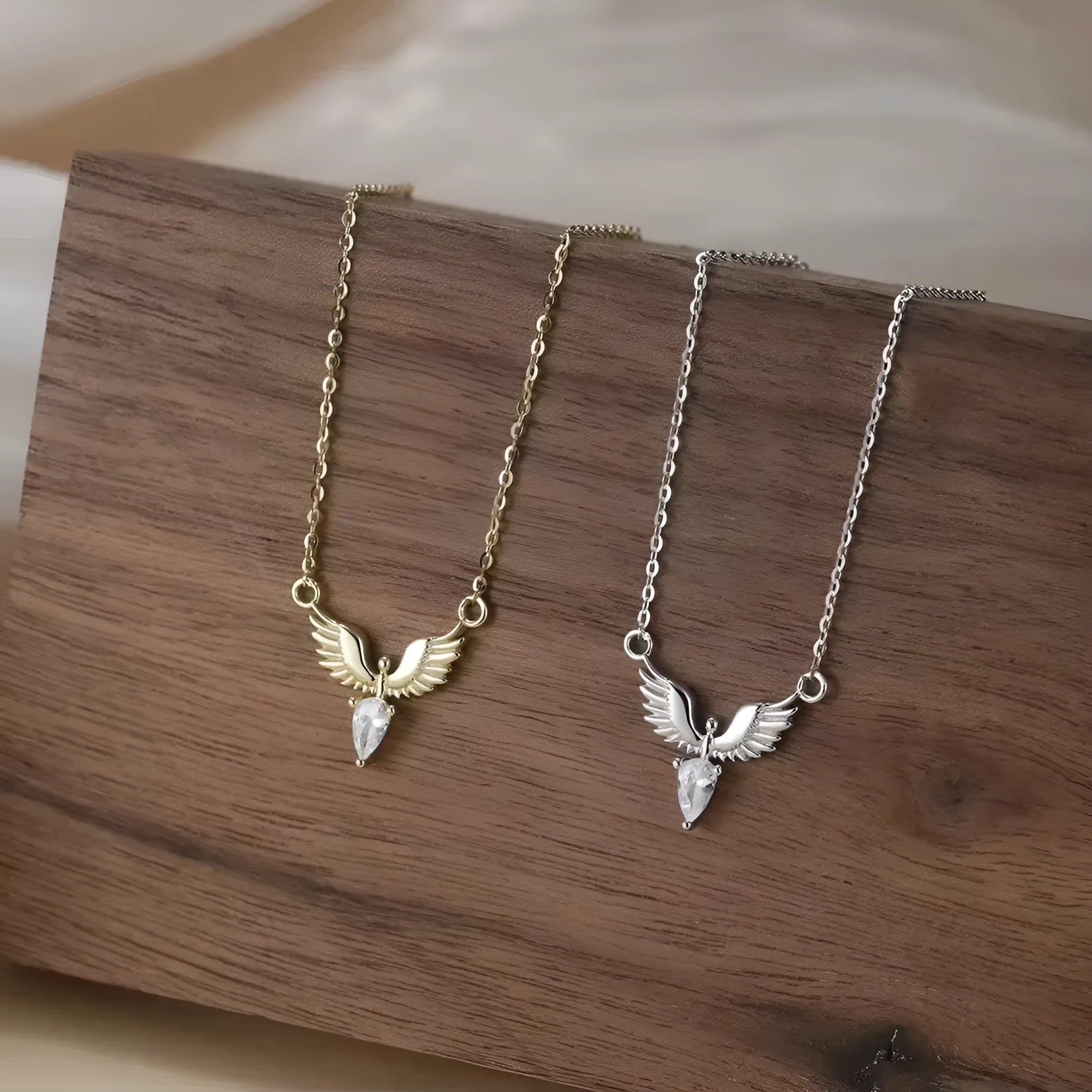 Sterling silver eagle pendant necklace on an O-ring chain, showing white gold and yellow gold colour options.