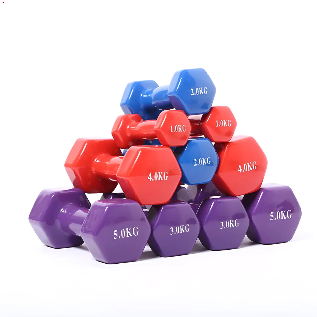 Bright green and pink plastic fitness dumbbells with glossy finish on a wooden floor.