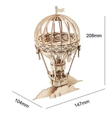 Four wooden 3D puzzle models showing an Airship, Balloon, Radio, and Pumpkin Carriage