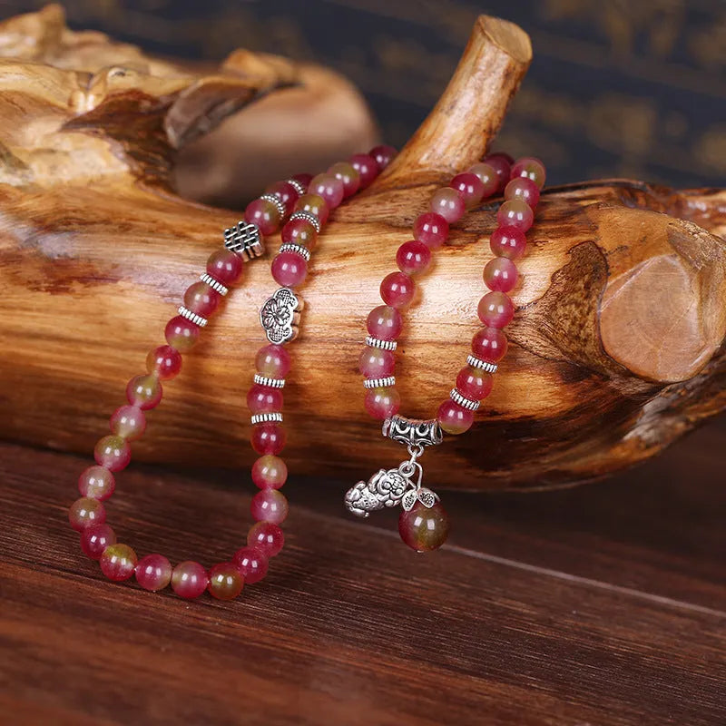 Handmade watermelon crystal Chinese knot bracelet with traditional geometric designs in 8mm and 6mm elephant style sizes
