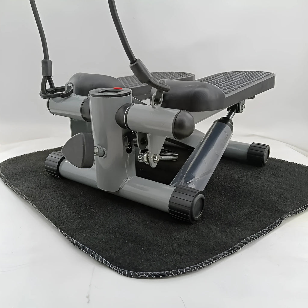 Silver grey household mini treadmill waist slimming machine with hydraulic resistance system.
