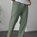 Men's khaki straight-leg casual trousers with a drawstring waist and a decorative ribbon pocket detail.