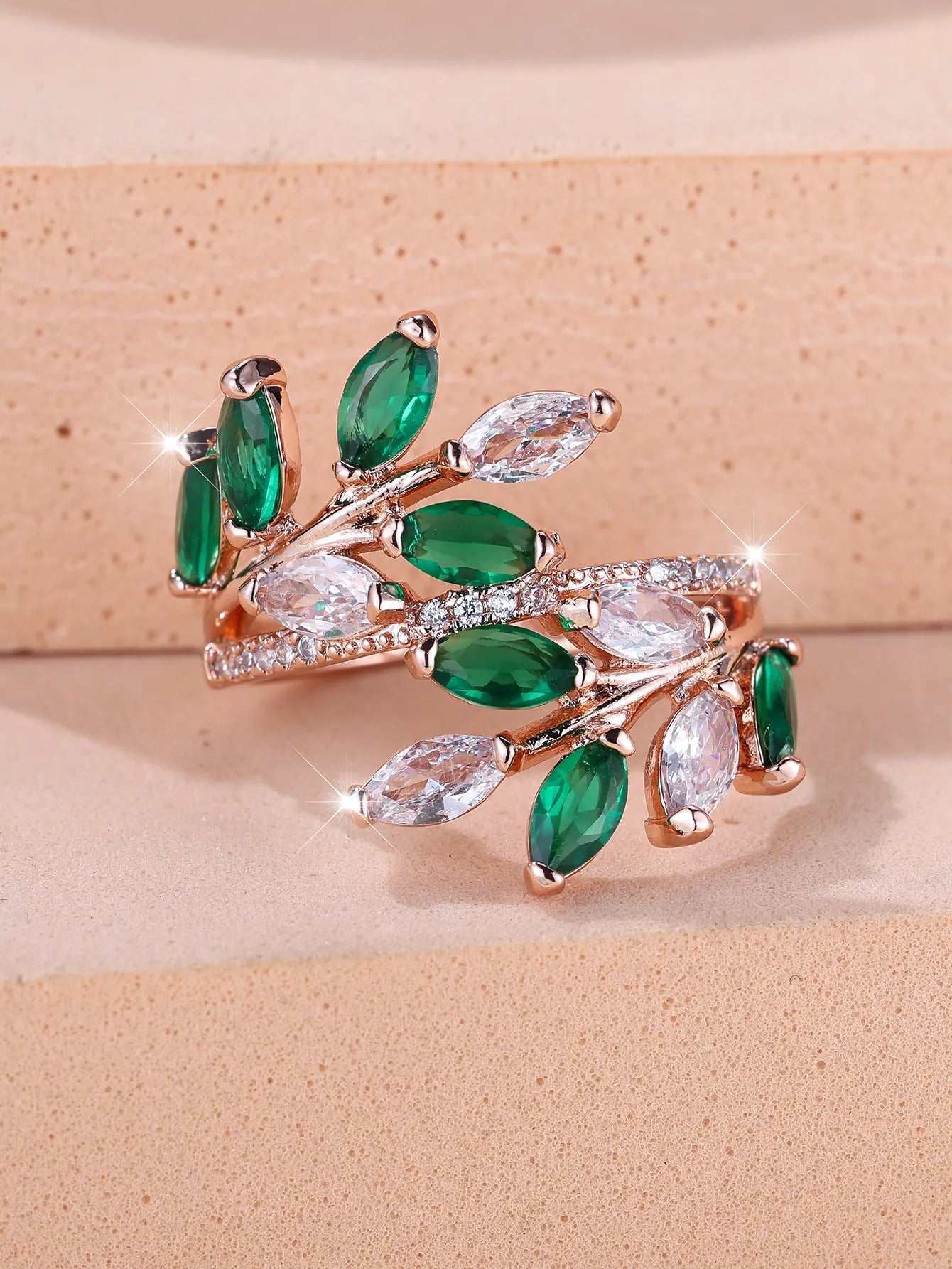 Adjustable leaf-shaped ring with horse eye cubic zirconia design in copper with rose gold plating