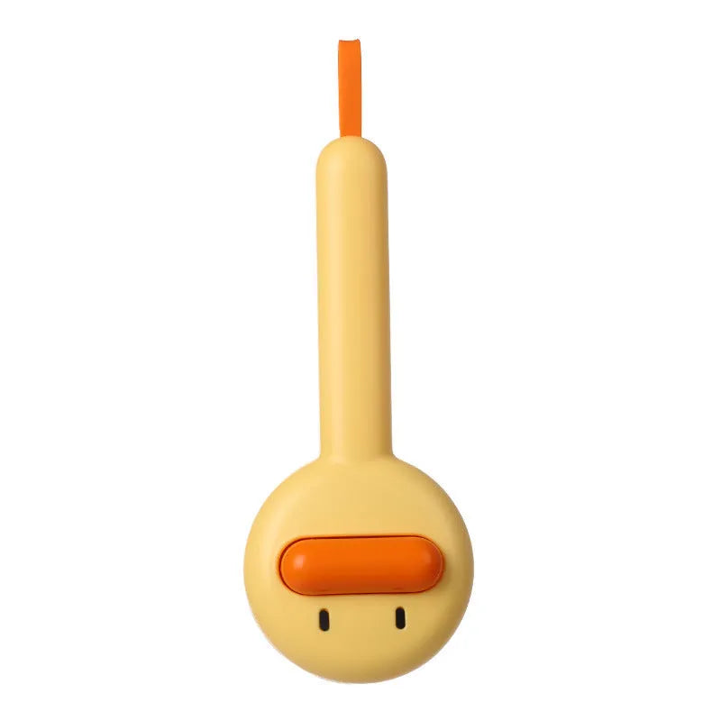 Small yellow duck-shaped pet grooming comb with open sections and needle teeth