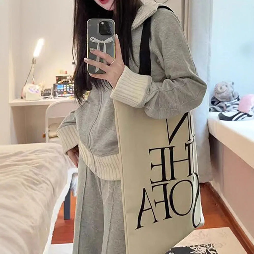 Women's light gray polyester two-piece set consisting of a pocket coat and wide leg trousers, shown flat lay view.