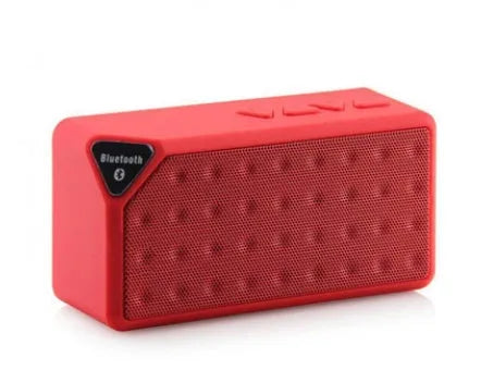 Cannon X3 small cube-shaped wireless Bluetooth portable speaker shown in one of five colours: black, blue, green, red, or yellow.