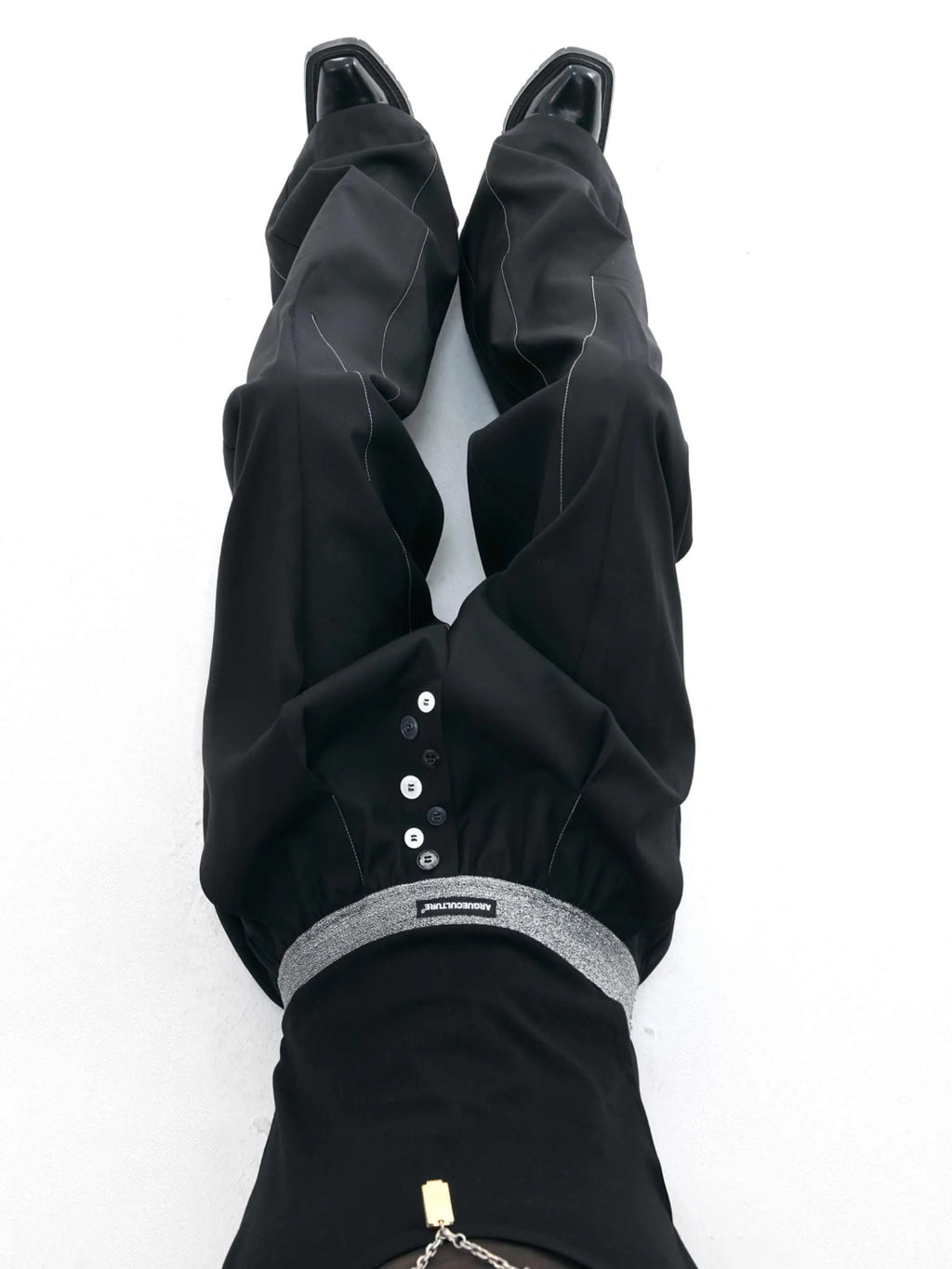 Straight-leg suit pants with button detail on leg in black or grey colour