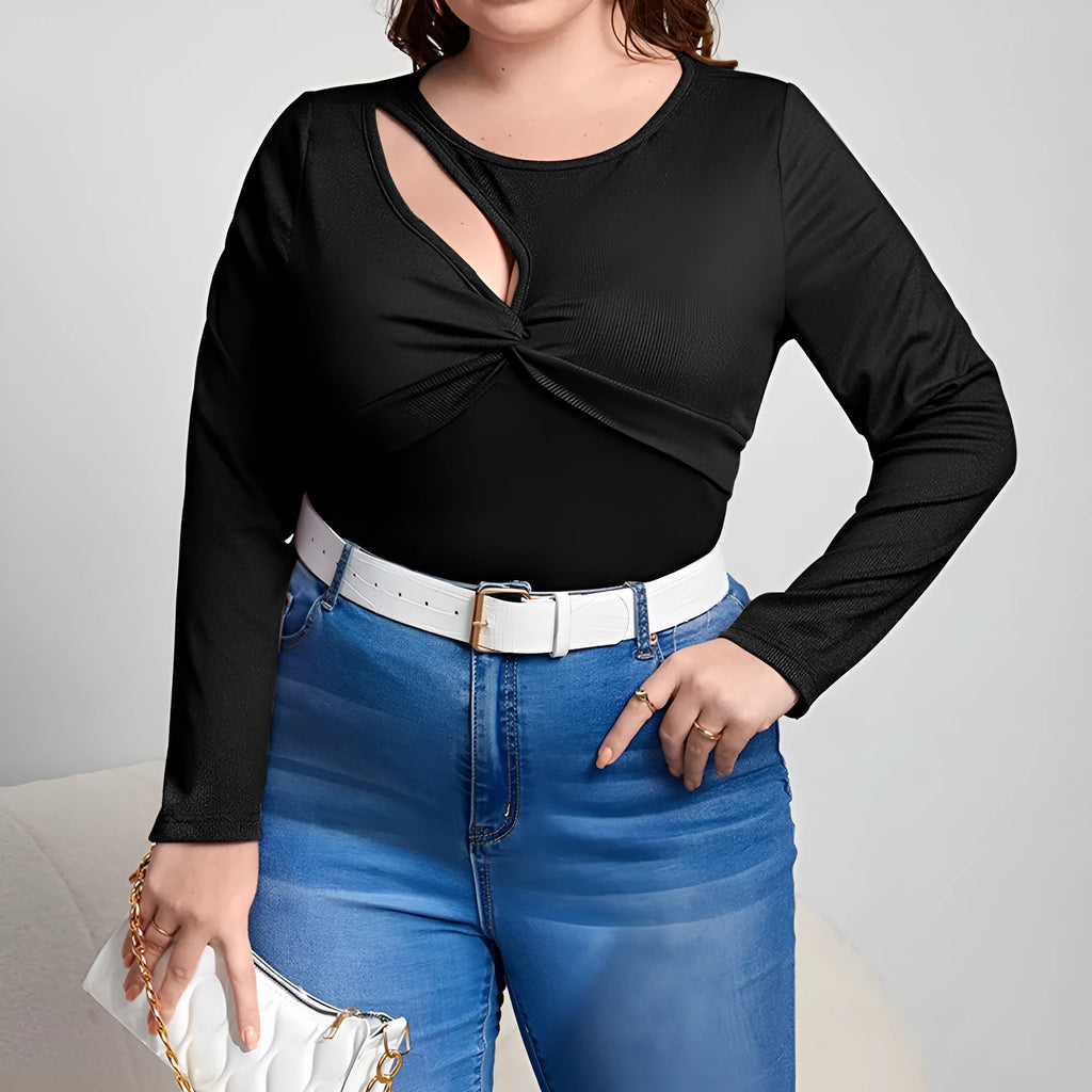 Women's slim-fit black knit pullover top with hollow-out design and long sleeves