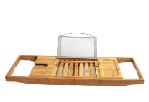 Natural bamboo bathtub caddy frame for organising shampoo and soap on a bathroom desktop.