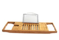Natural bamboo bathtub caddy frame for organising shampoo and soap on a bathroom desktop.