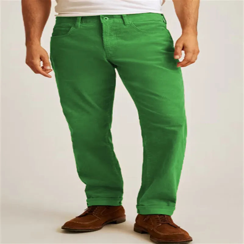Man wearing loose fit straight-leg corduroy trousers in a solid colour.