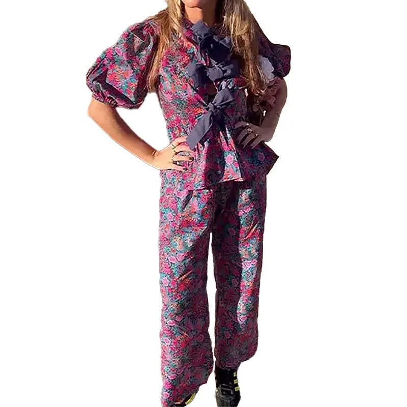 Women's floral print trouser suit with puff sleeve blouse and matching trousers
