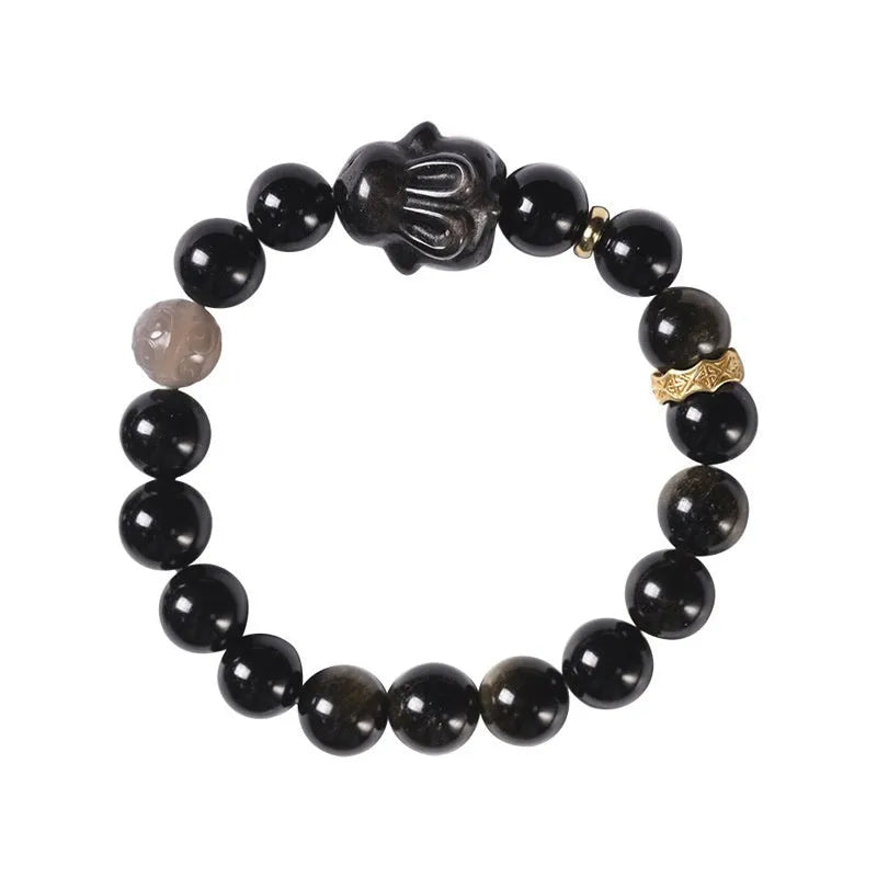 Handmade national style bracelet with a lying rabbit charm, grey agate, and metal details on a wrist.