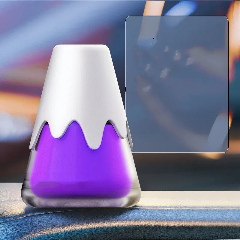 Refillable glass car aromatherapy unit in one of four colour options, showing compact size for dashboard or vent mounting.