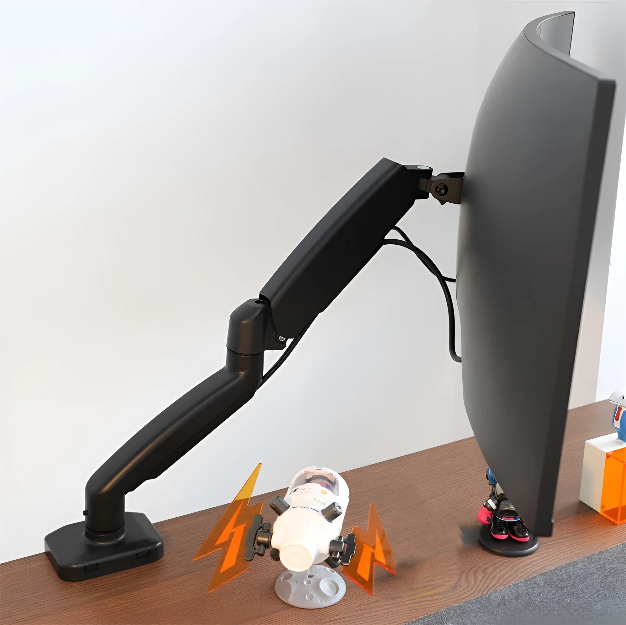 Black LCD screen rotating telescopic bracket elevated on desk