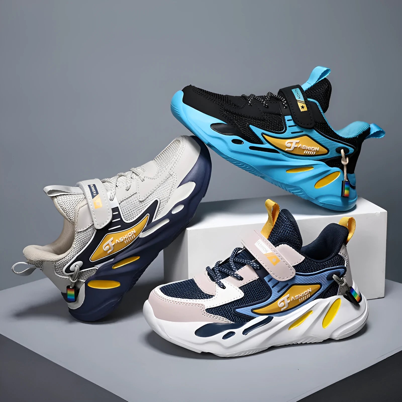 Boys' dark blue and light blue sports running shoes with Velcro strap and mesh upper.