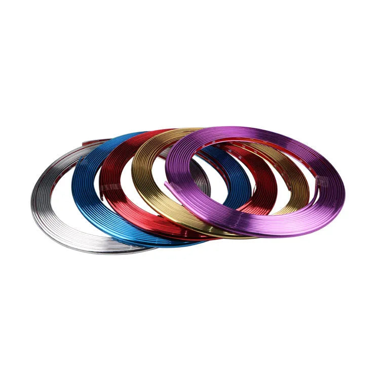 Galvanised purple PVC wheel hub trim on car wheel showing decorative application