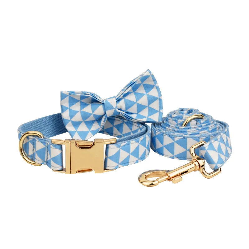 Blue cloth dog collar, leash, bow, and vest four-piece pet accessory set shown with size options